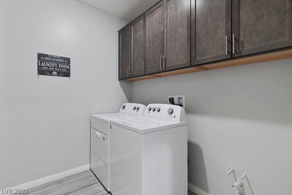 4191 Velvet View Street Las Vegas, NV 89129 - Photo 25 of 44 Laundry room with cabinet space and independent washer and dryer
