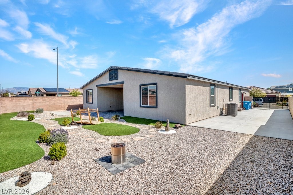 4191 Velvet View Street Las Vegas, NV 89129 - Photo 26 of 44 Back of house featuring a patio, a fenced backyard, and stucco siding