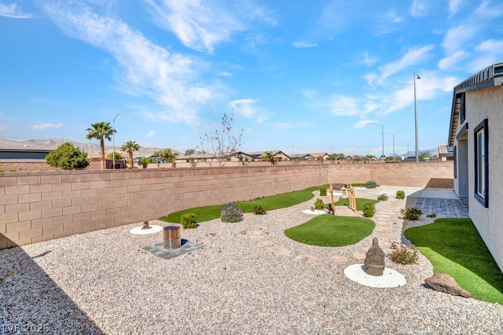 4191 Velvet View Street Las Vegas, NV 89129 - Photo 27 of 44 Fenced backyard with a patio area
