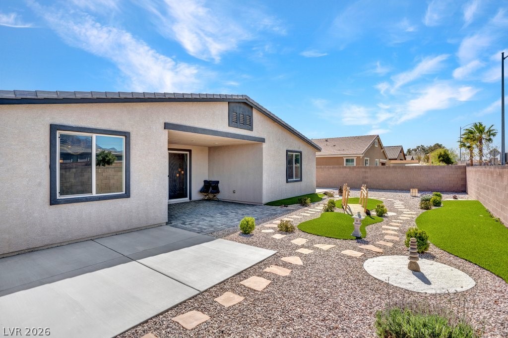 4191 Velvet View Street Las Vegas, NV 89129 - Photo 29 of 44 Back of property featuring a patio area, a fenced backyard, and stucco siding