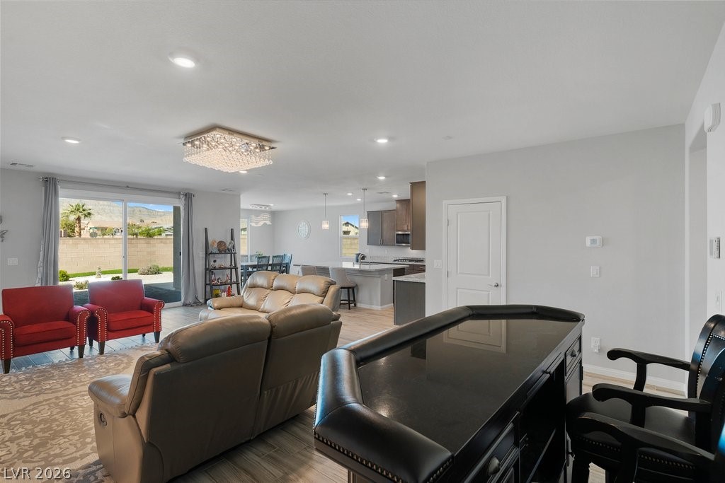 4191 Velvet View Street Las Vegas, NV 89129 - Photo 3 of 44 Living area featuring light wood finished floors and recessed lighting
