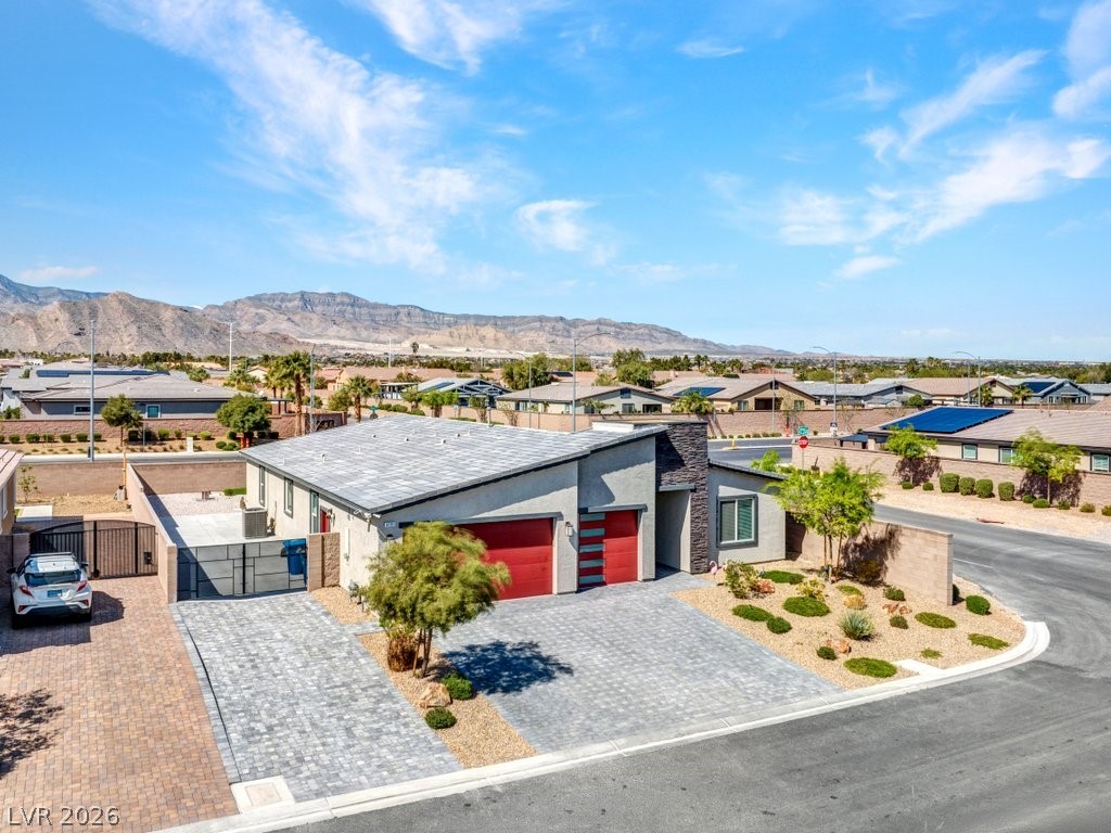4191 Velvet View Street Las Vegas, NV 89129 - Photo 32 of 44 View of front of home with a gate, a garage, a residential view, and stucco siding