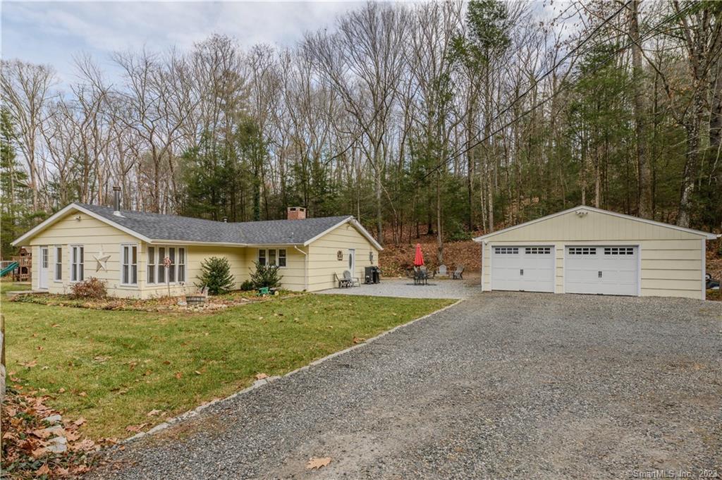 229 Beaver Meadow Road Haddam, CT 06438 - Photo 1 of 1 a front view of a house with a yard and trees