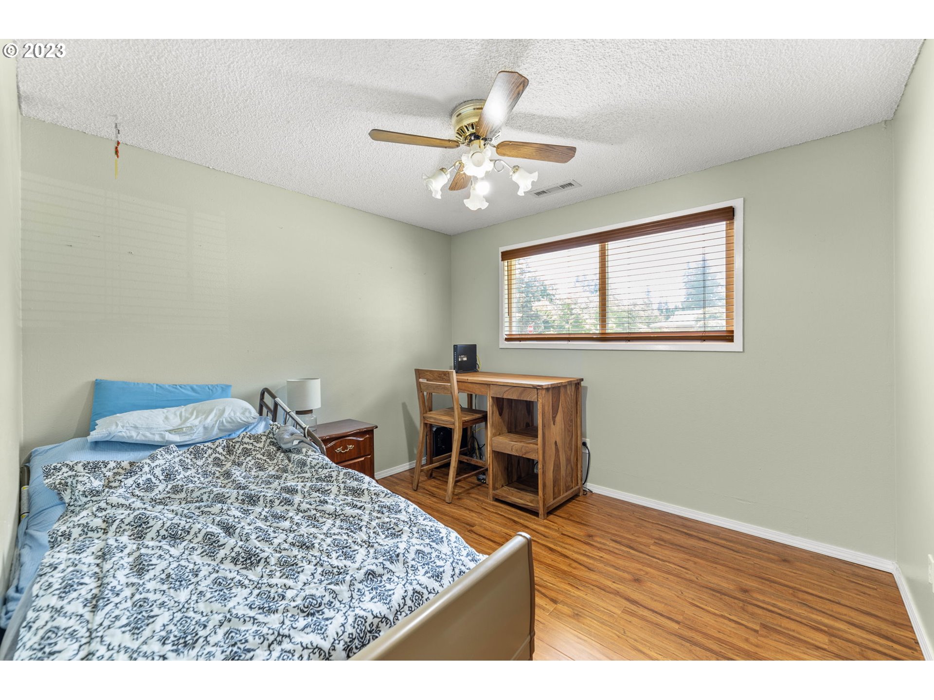 12204 Northeast 7th Street Vancouver, WA 98684 - Photo 13 of 30 a bedroom with a bed and a table in it