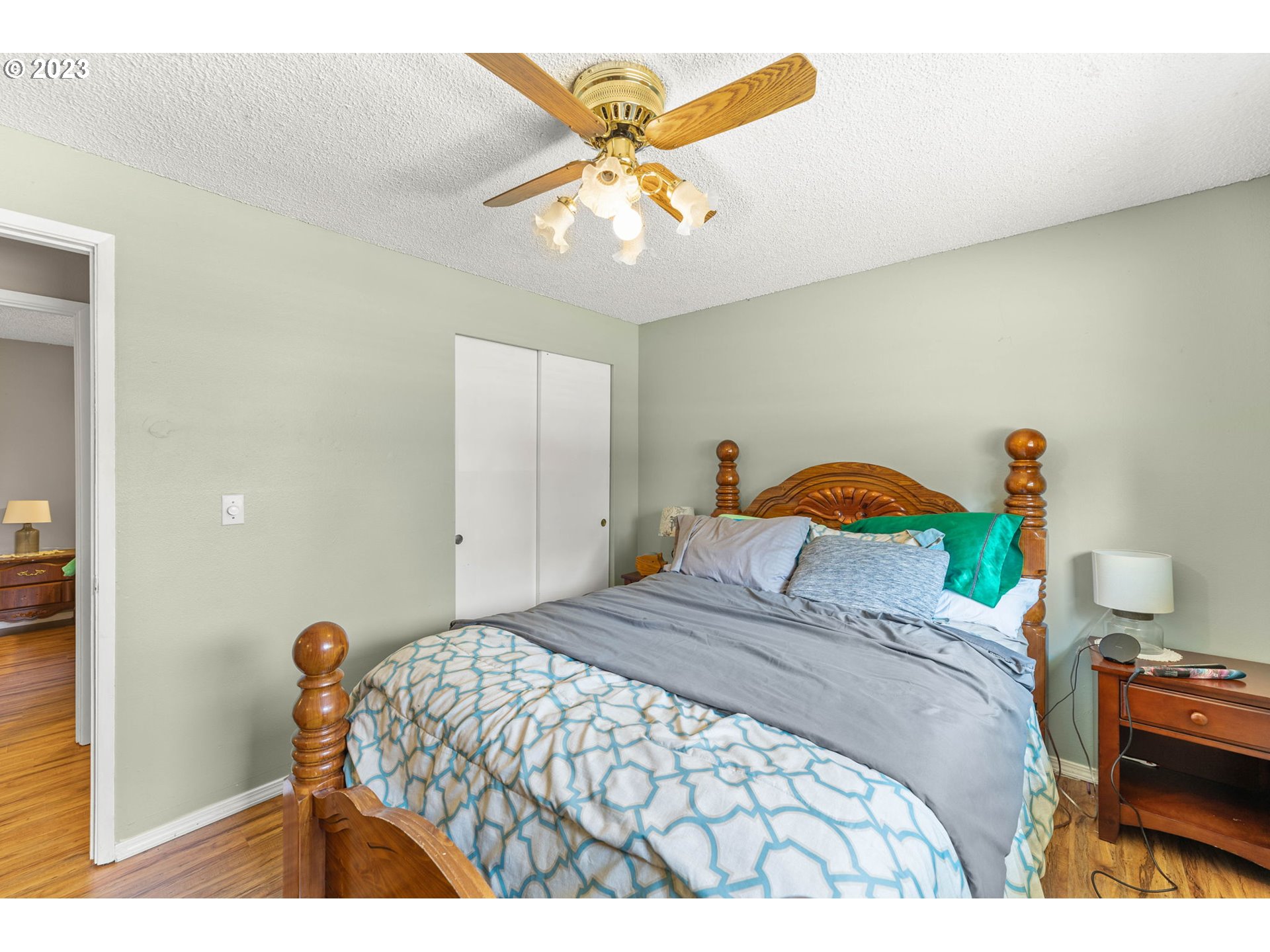 12204 Northeast 7th Street Vancouver, WA 98684 - Photo 15 of 30 a bedroom with a bed and a chandelier