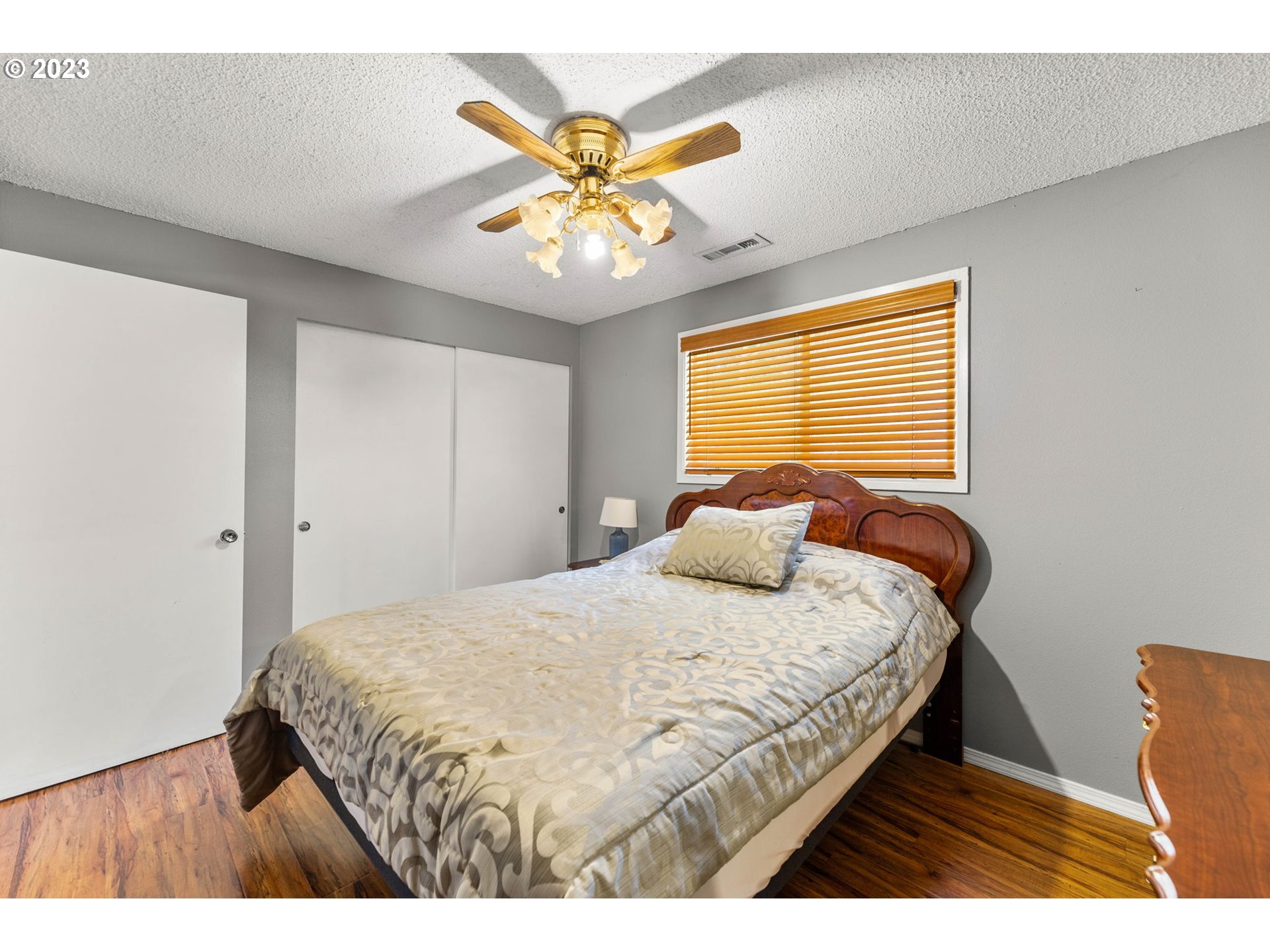 12204 Northeast 7th Street Vancouver, WA 98684 - Photo 17 of 30 a bedroom with a bed and a chandelier