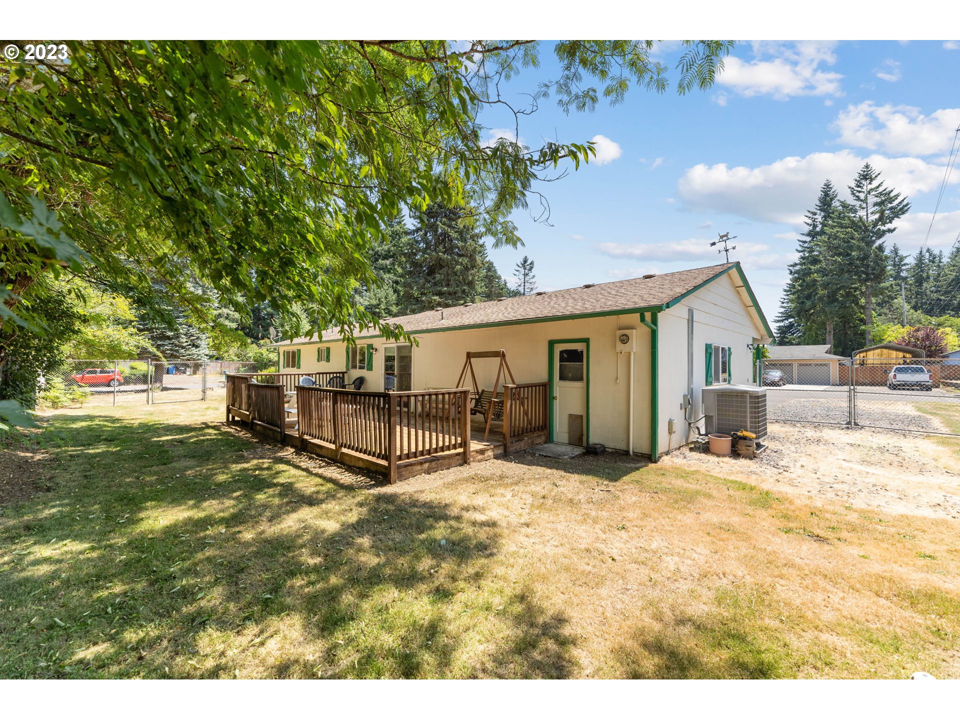 12204 Northeast 7th Street Vancouver, WA 98684 - Photo 25 of 30 a view of a house with backyard and a tree