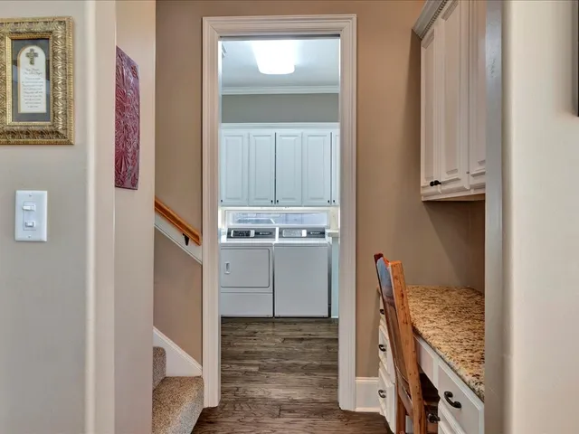 a view of an entryway with wooden floor