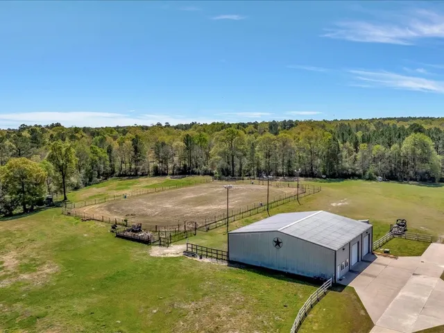 a view of a swimming pool with a yard