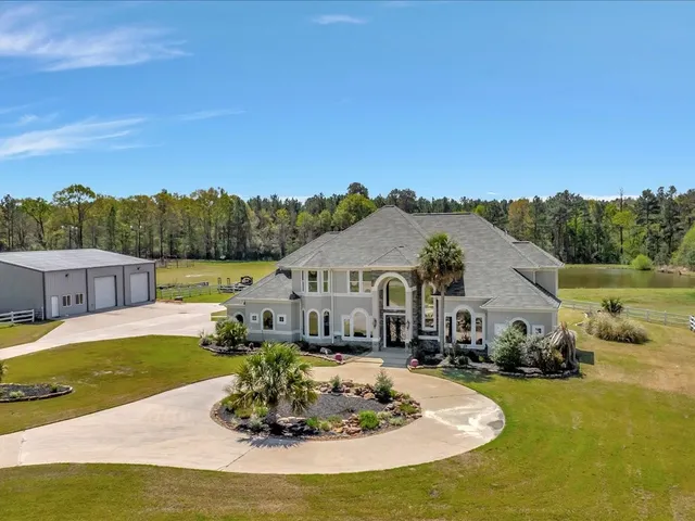 a view of a house with a big yard