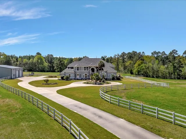 a view of a swimming pool with a yard