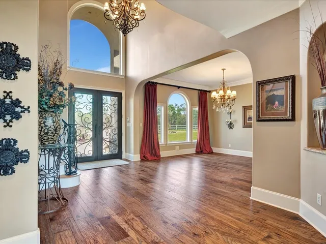a view of an entryway with wooden floor
