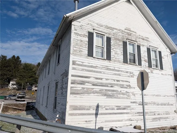 a front view of a house with a ocean view