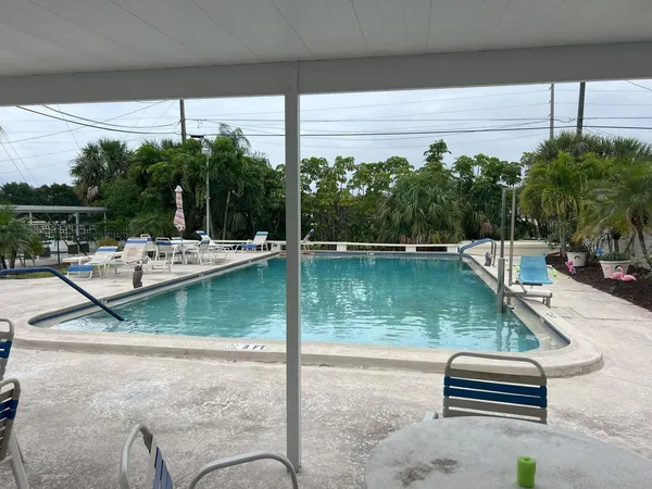 a view of swimming pool with a patio