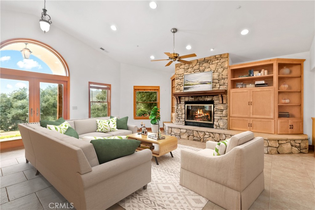 40635 De Luz Road Fallbrook, CA 92028 - Photo 20 of 75 a living room with furniture fireplace and a large window