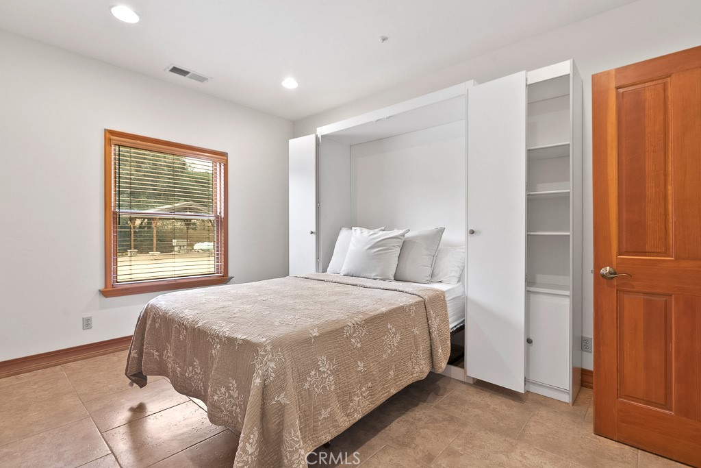 40635 De Luz Road Fallbrook, CA 92028 - Photo 31 of 75 a bedroom with a bed and a window