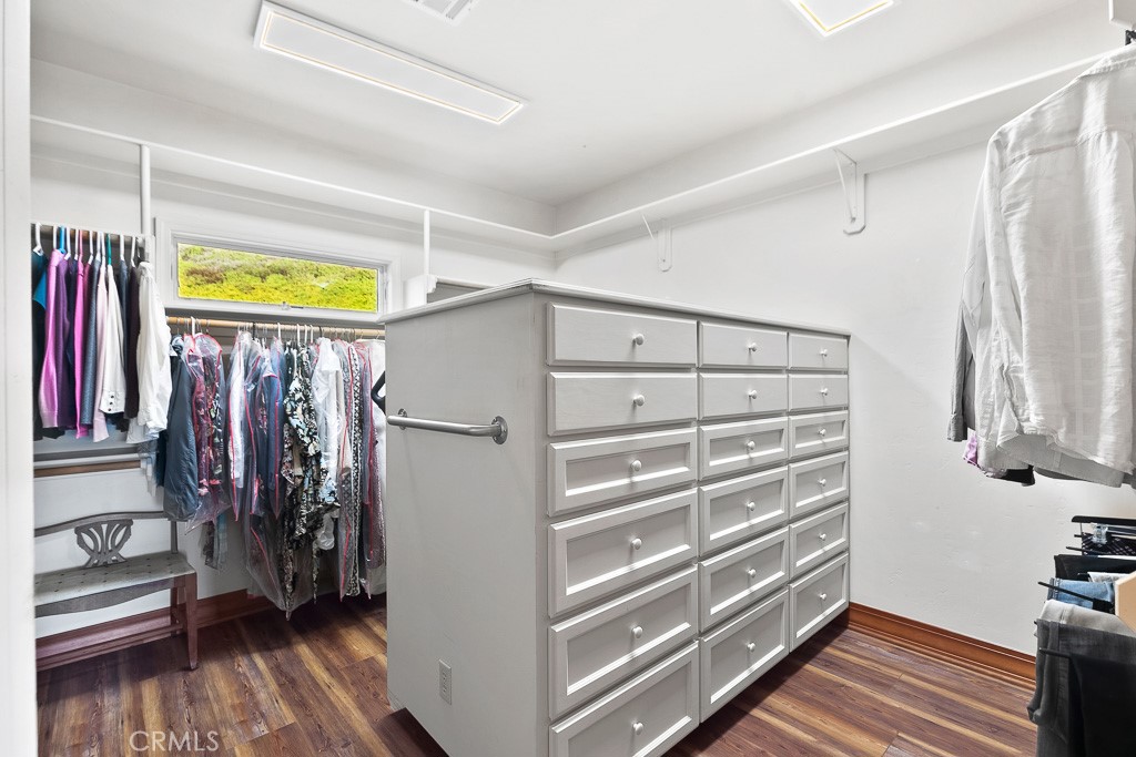 40635 De Luz Road Fallbrook, CA 92028 - Photo 36 of 75 a view of walk in closet with clothes and shoes