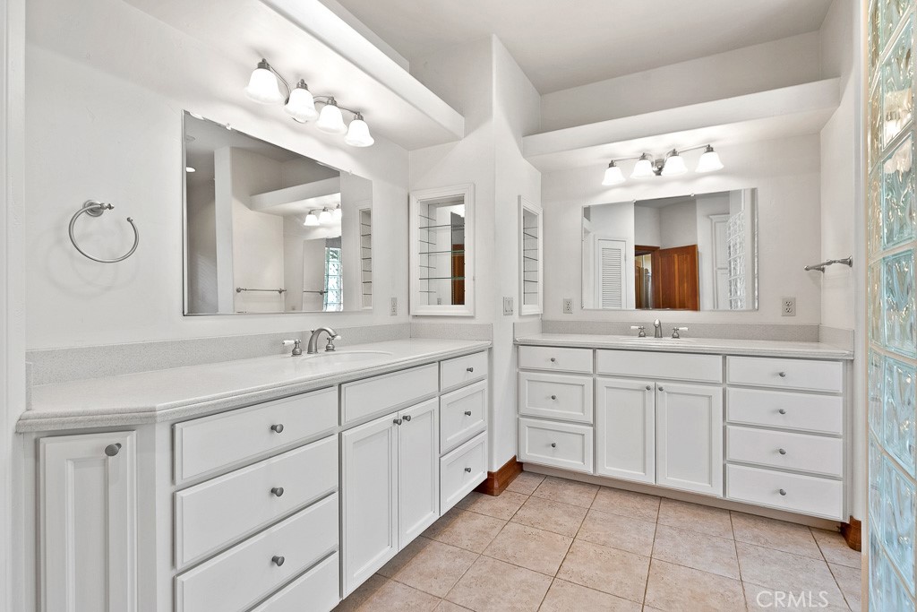 40635 De Luz Road Fallbrook, CA 92028 - Photo 38 of 75 a spacious bathroom with a granite countertop sink mirror and cabinets