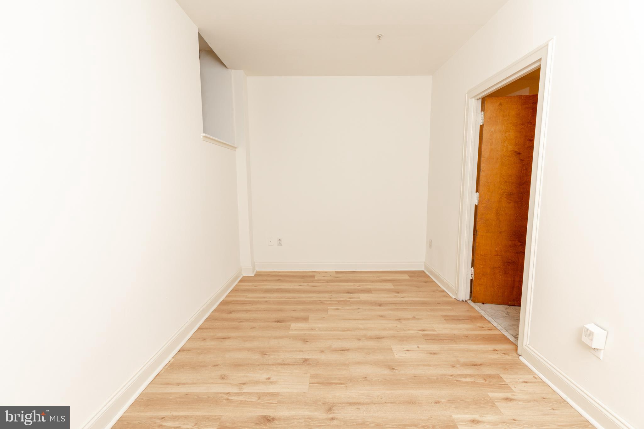 1411-4 Walnut Street, Unit 802 Philadelphia, PA 19102 - Photo 13 of 20 a view of a room with wooden floor and bench