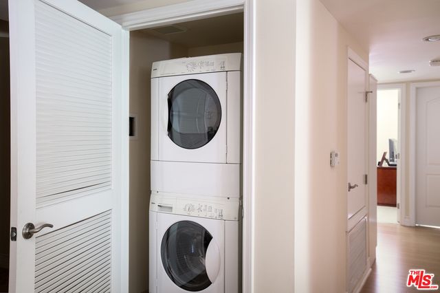 a view of a hallway with washer and dryer
