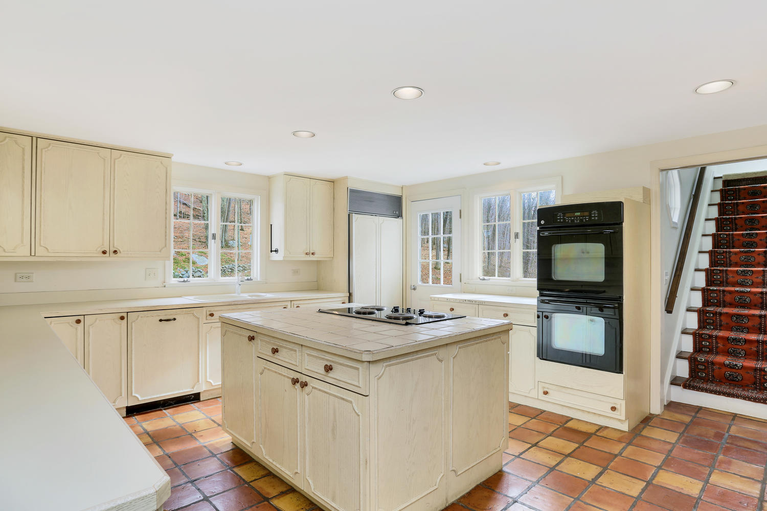 129 Hickok Road New Canaan, CT 06840 - Photo 15 of 32 a kitchen with stainless steel appliances granite countertop a stove and a sink