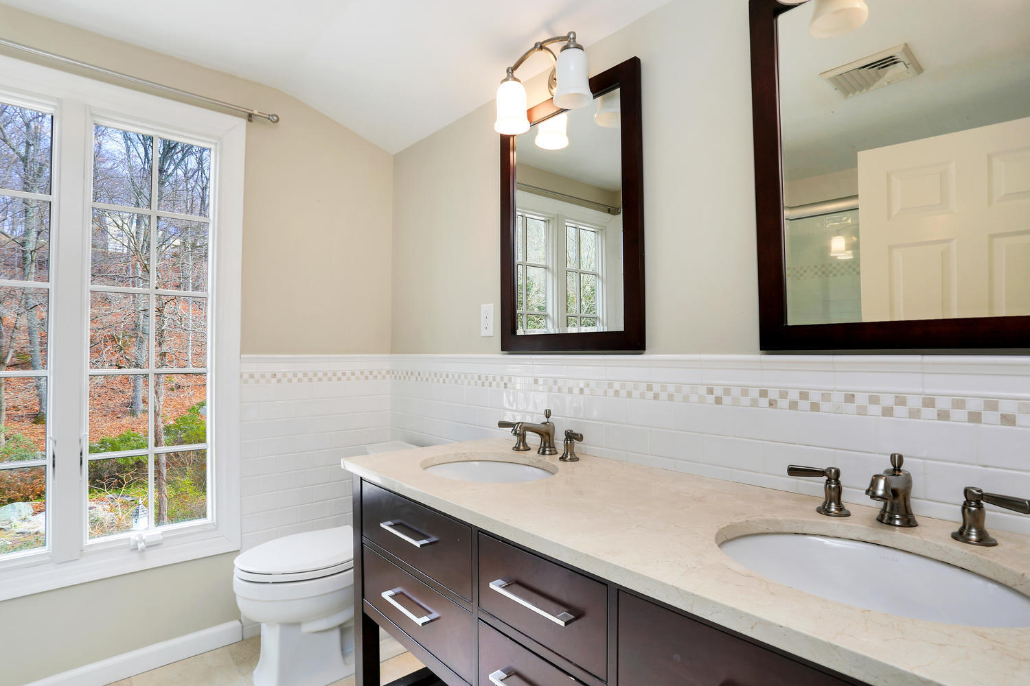 129 Hickok Road New Canaan, CT 06840 - Photo 18 of 32 a bathroom with a sink vanity mirror and toilet