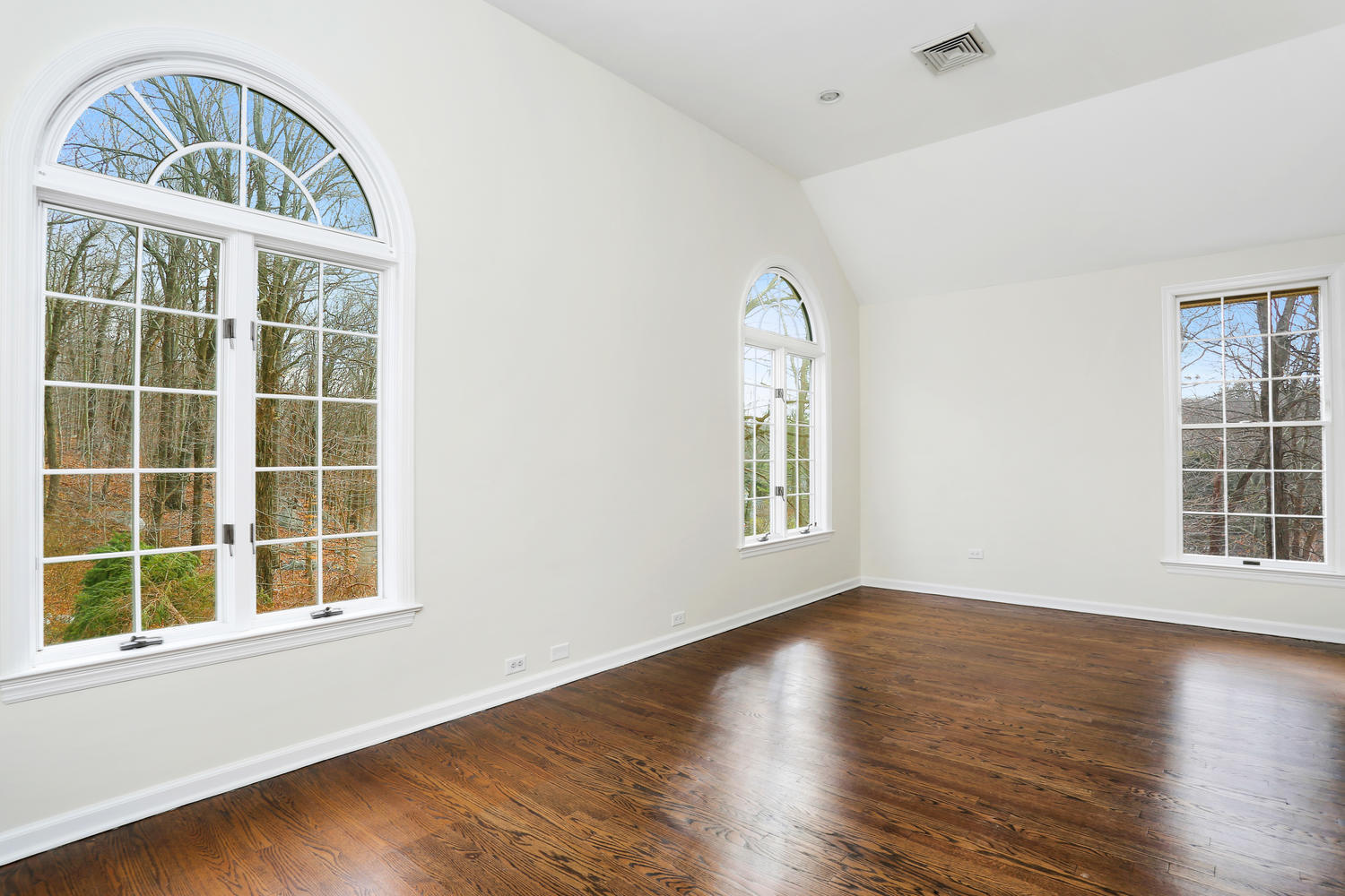 129 Hickok Road New Canaan, CT 06840 - Photo 19 of 32 an empty room with wooden floor windows and cabinet