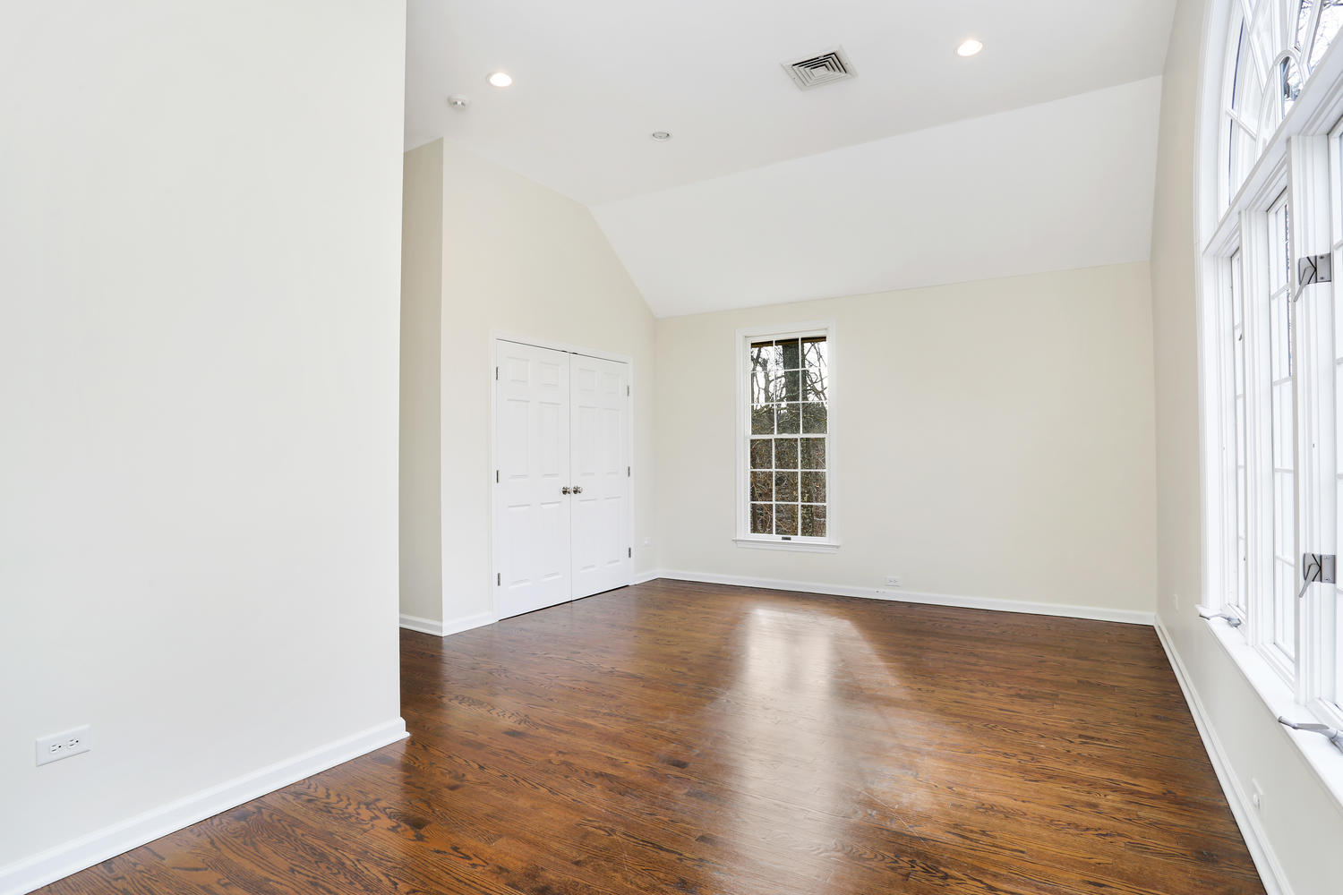 129 Hickok Road New Canaan, CT 06840 - Photo 20 of 32 an empty room with wooden floor and windows