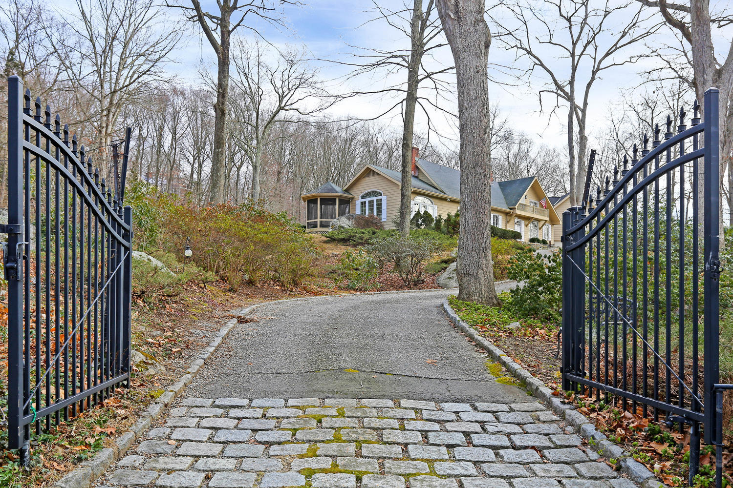 129 Hickok Road New Canaan, CT 06840 - Photo 27 of 32 a view of a yard and front view of a house