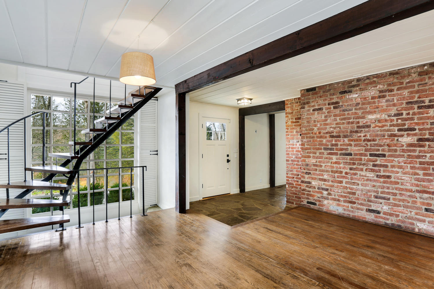 129 Hickok Road New Canaan, CT 06840 - Photo 4 of 32 a view of an entryway with wooden floor and stairs
