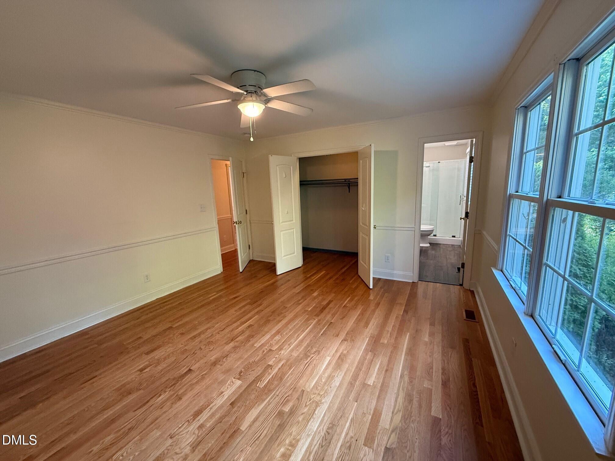 4108 Pleasant Grove Church Road Raleigh, NC 27613 - Photo 16 of 38 wooden floor in an empty room with a fireplace