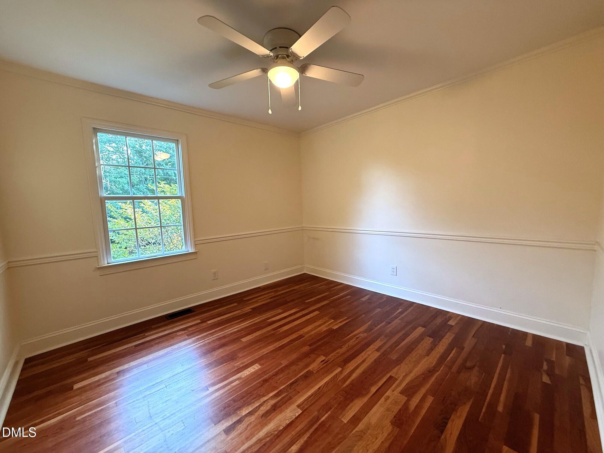 4108 Pleasant Grove Church Road Raleigh, NC 27613 - Photo 22 of 38 wooden floor in an empty room with a window