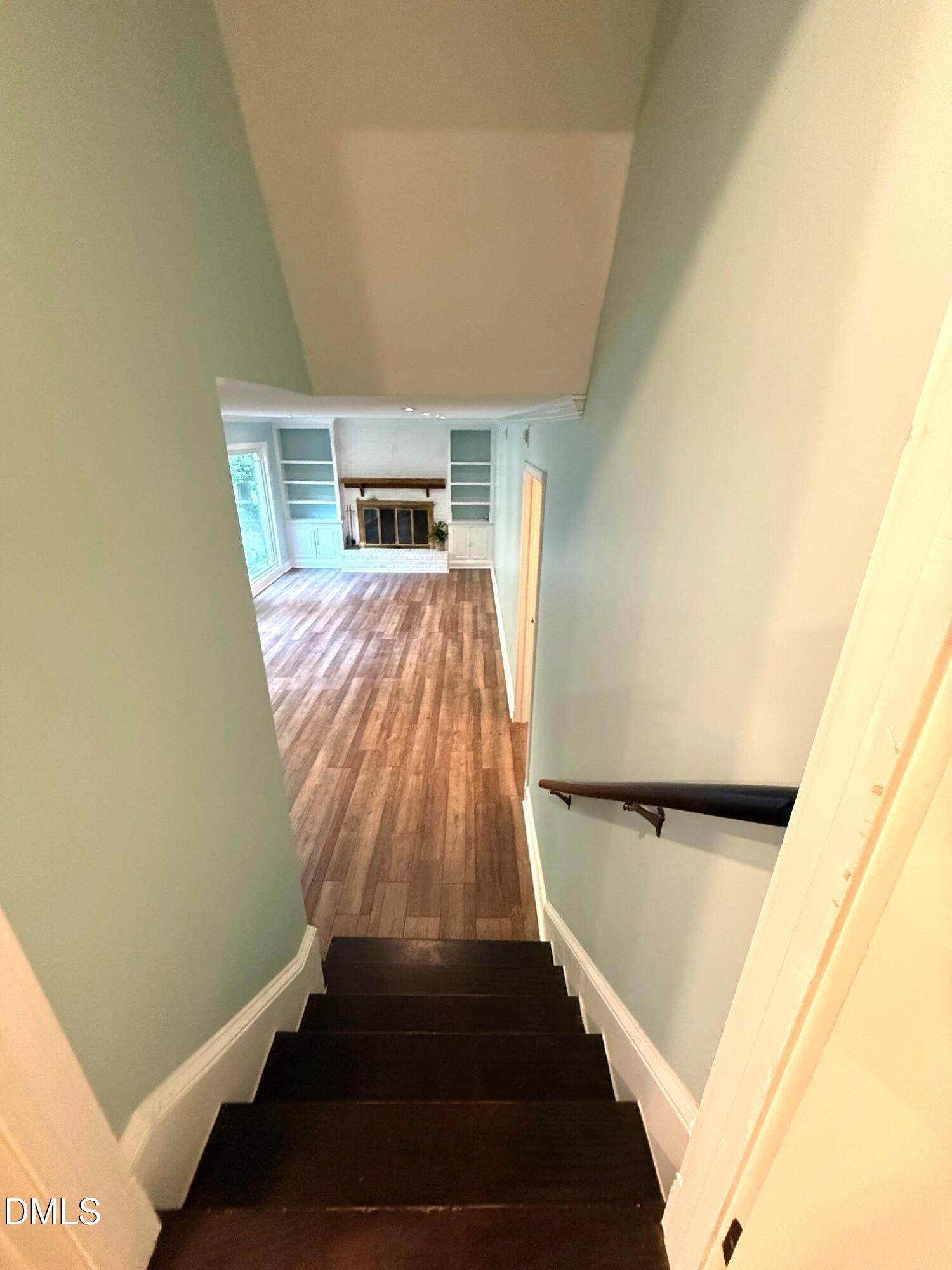 4108 Pleasant Grove Church Road Raleigh, NC 27613 - Photo 24 of 38 a view of a hallway with wooden floor and staircase