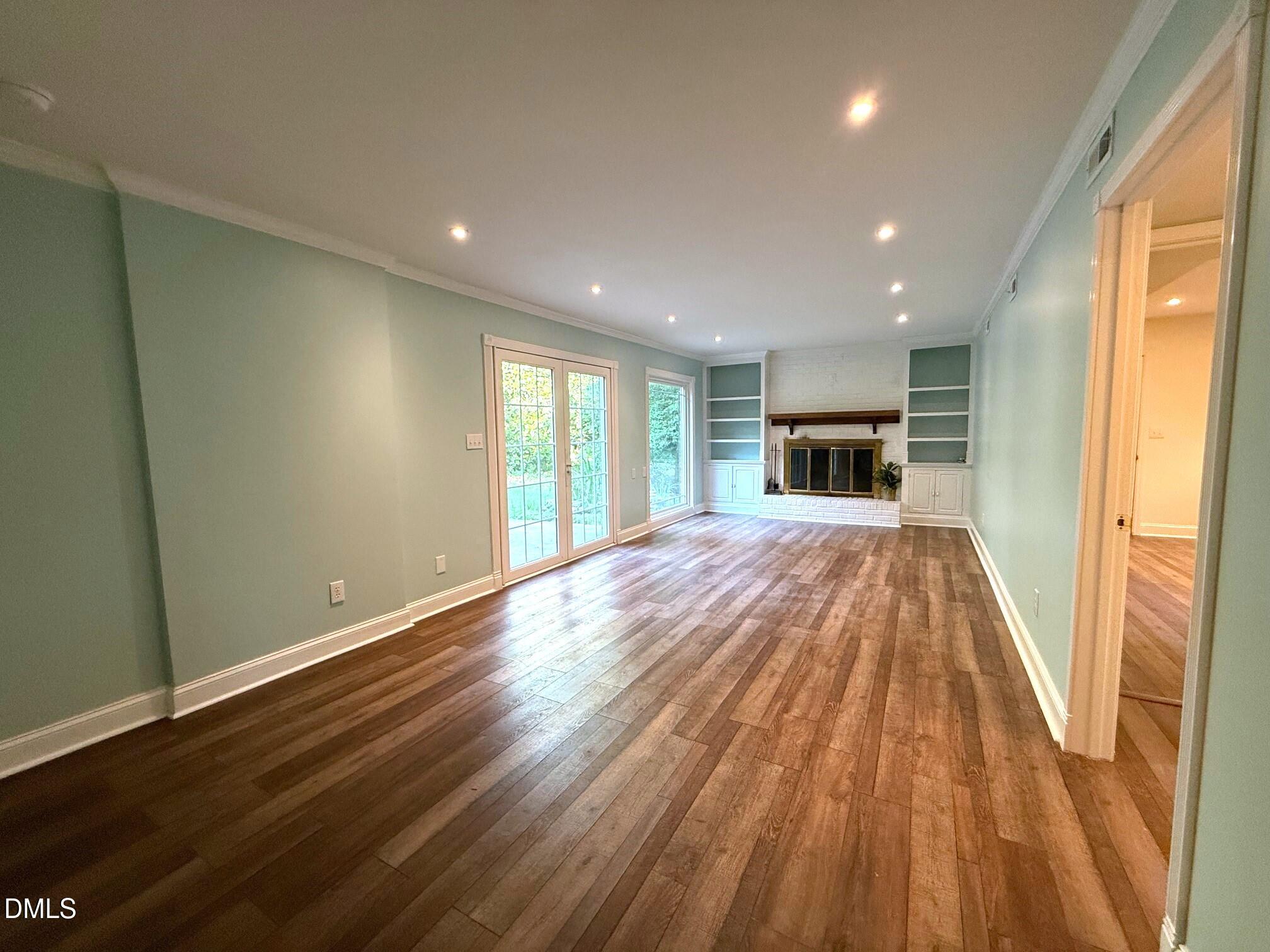 4108 Pleasant Grove Church Road Raleigh, NC 27613 - Photo 26 of 38 wooden floor in an empty room with a window