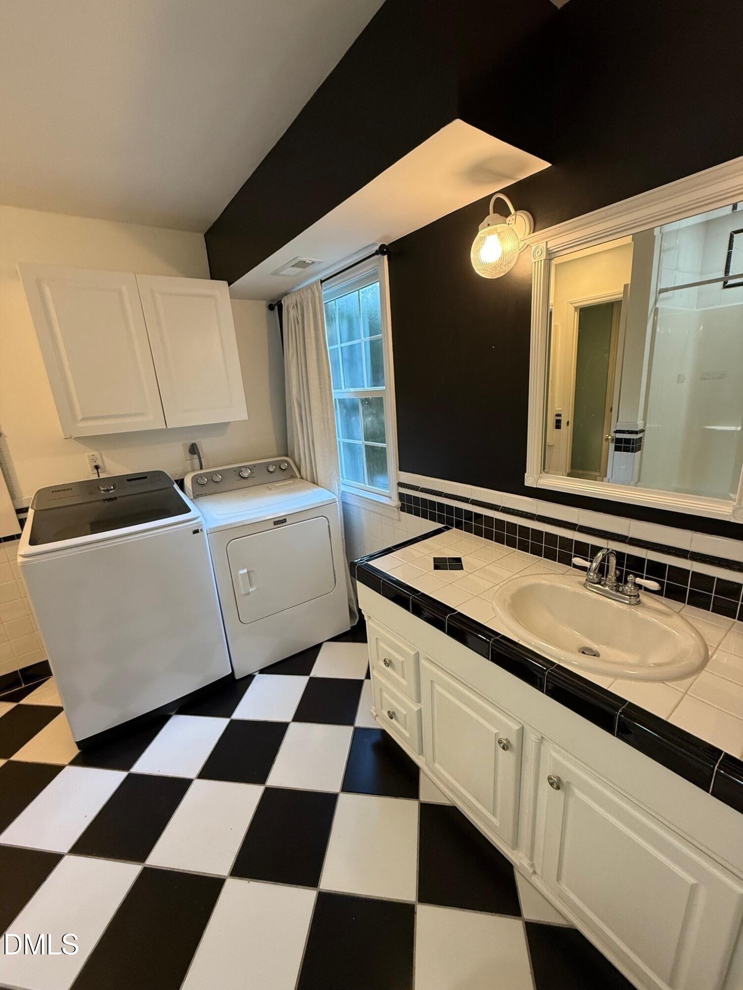 4108 Pleasant Grove Church Road Raleigh, NC 27613 - Photo 29 of 38 a room with a black white checkered floor