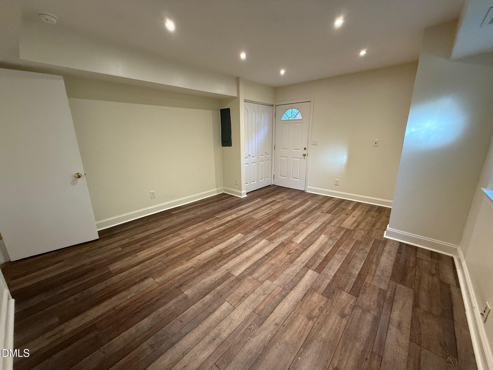 4108 Pleasant Grove Church Road Raleigh, NC 27613 - Photo 32 of 38 an empty room with wooden floor and windows
