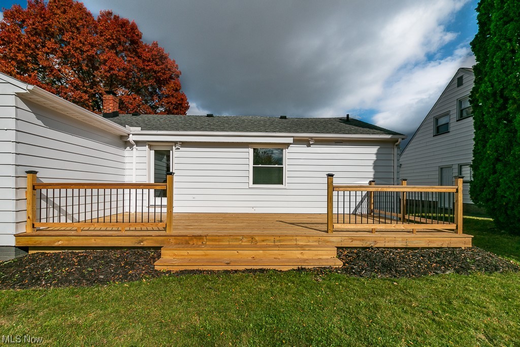 4980 Emmet Road Lyndhurst, OH 44124 - Photo 37 of 39 Back of house featuring a wooden deck and a yard