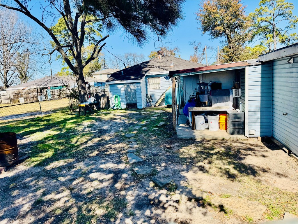 9105 Exeter Street Houston, TX 77093 - Photo 20 of 21 a view of a house with a backyard porch and sitting area