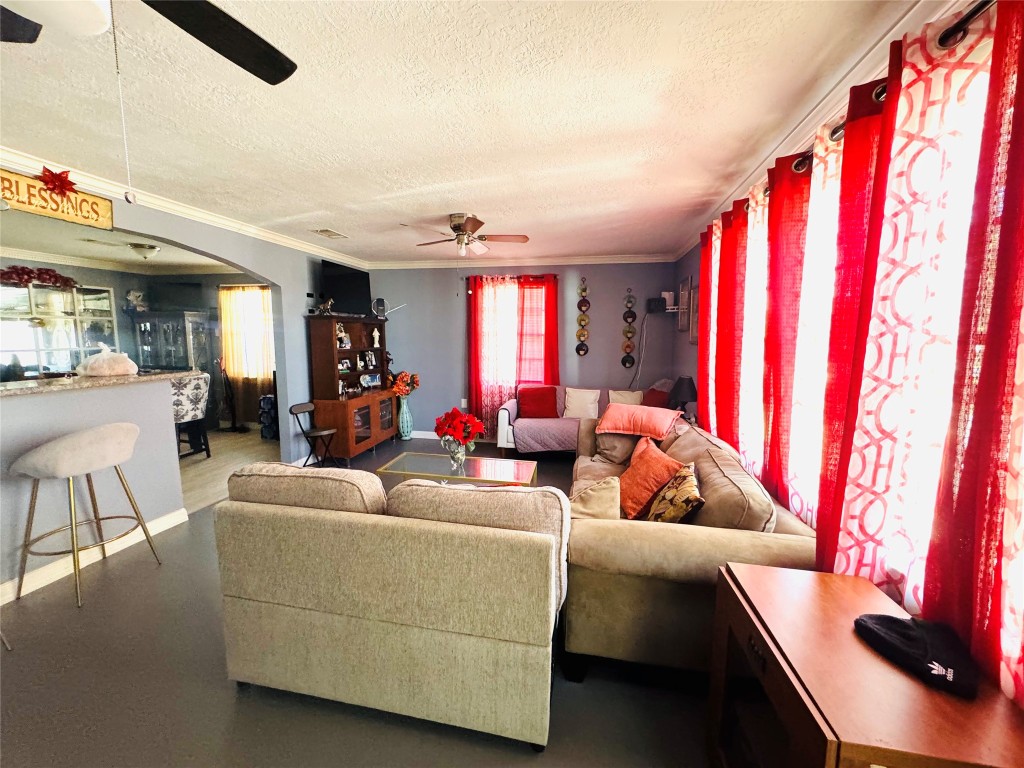 9105 Exeter Street Houston, TX 77093 - Photo 5 of 21 a living room with furniture and a large window