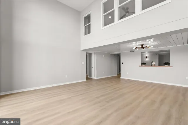 a view of a kitchen with a sink and cabinets