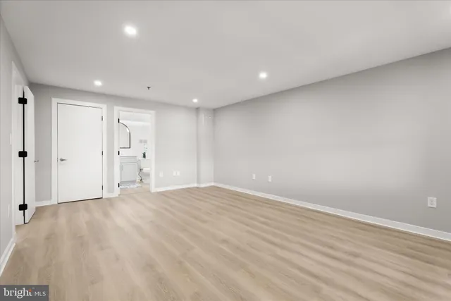 a bathroom with a sink toilet and a mirror