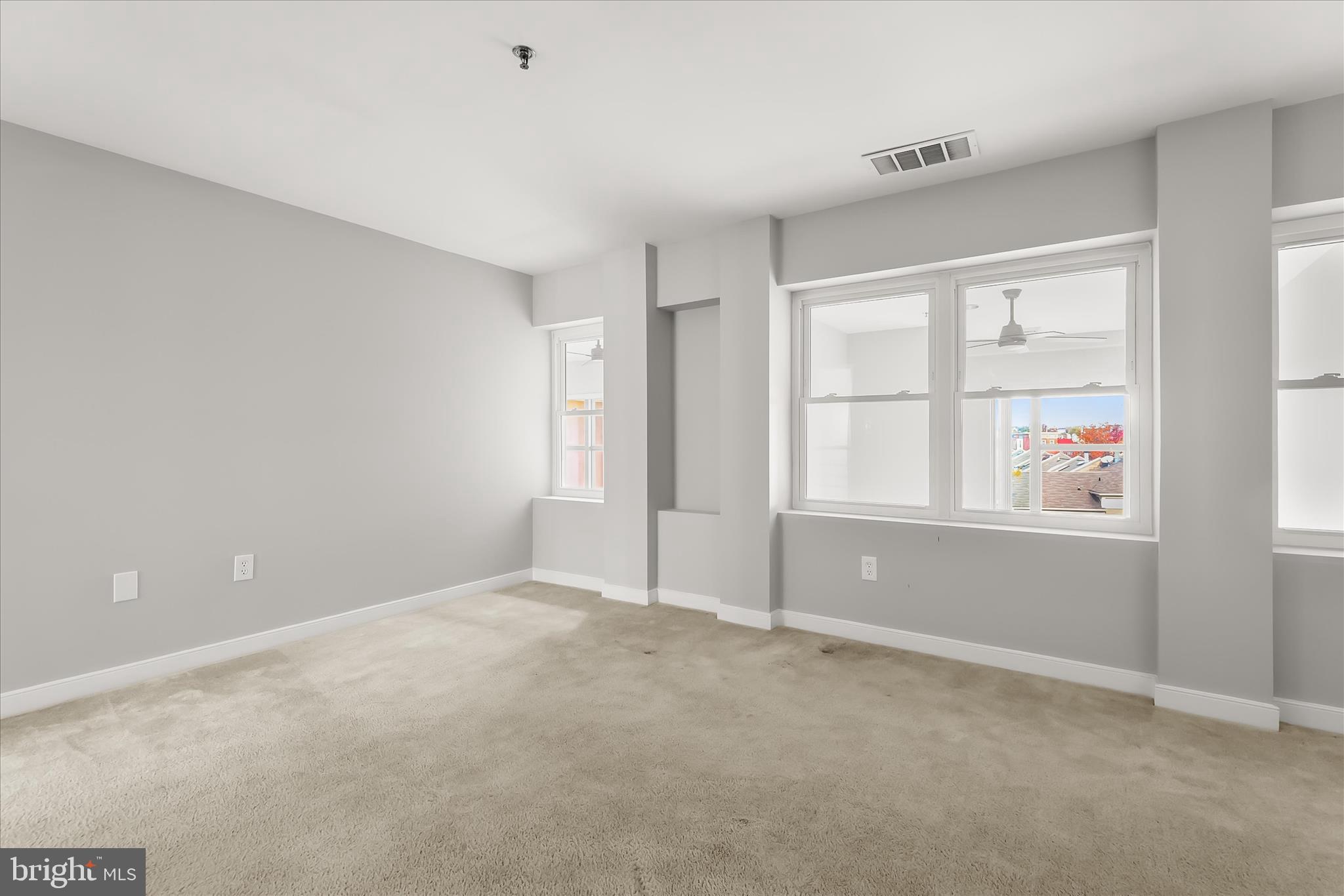 2901 Boston Street, Unit 302 Baltimore, MD 21224 - Photo 35 of 61 a view of an empty room with a window