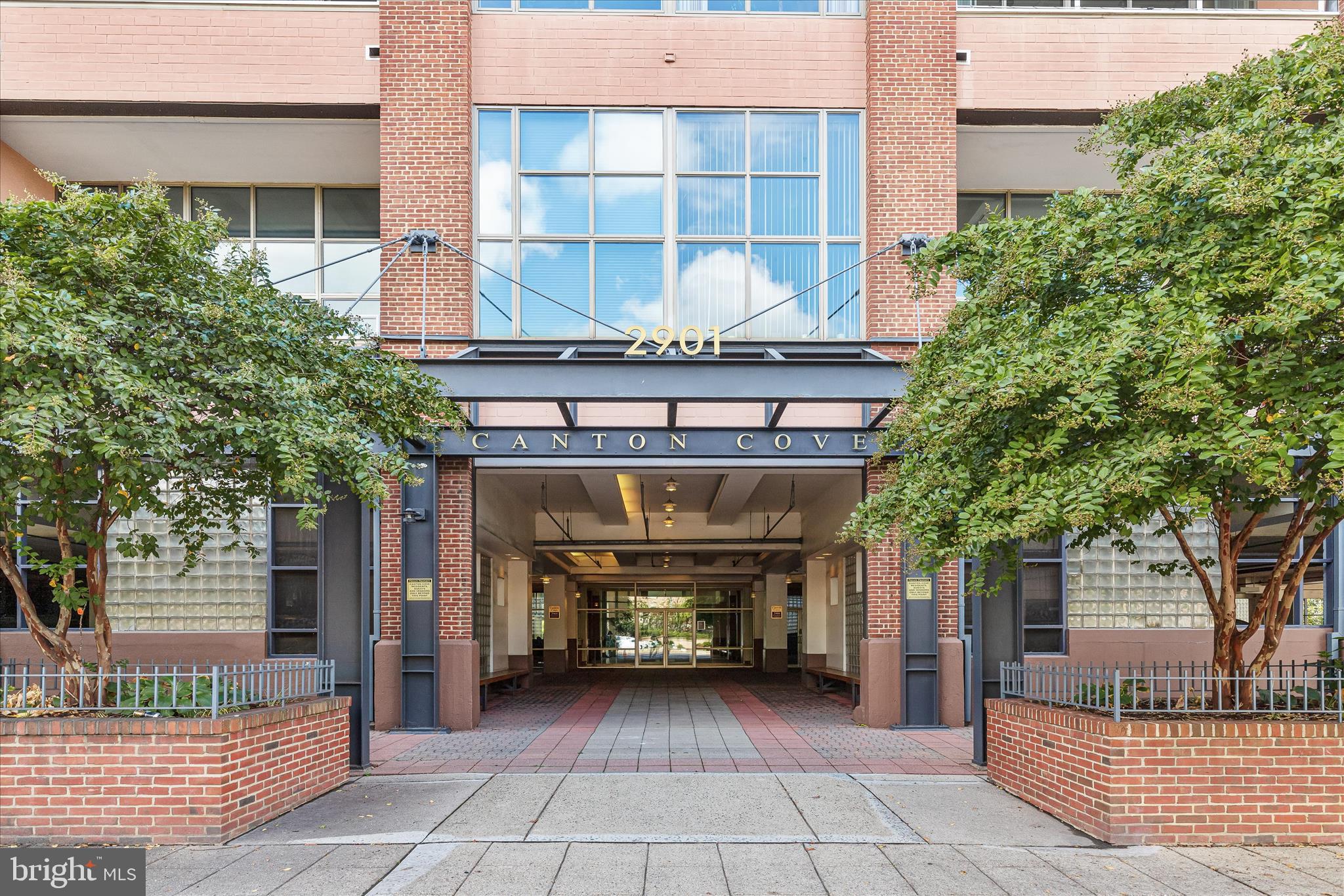 2901 Boston Street, Unit 302 Baltimore, MD 21224 - Photo 40 of 61 a front view of a house with a garden