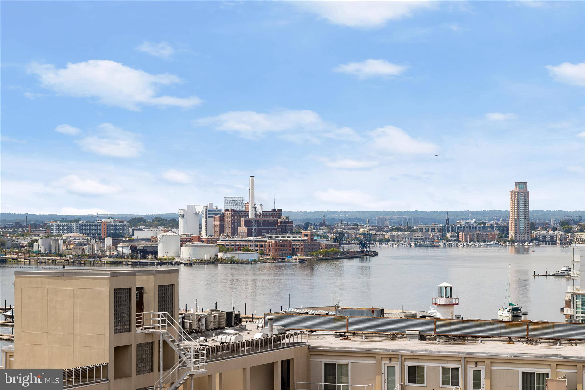 2901 Boston Street, Unit 302 Baltimore, MD 21224 - Photo 52 of 61 a view of a lake and building in front of it