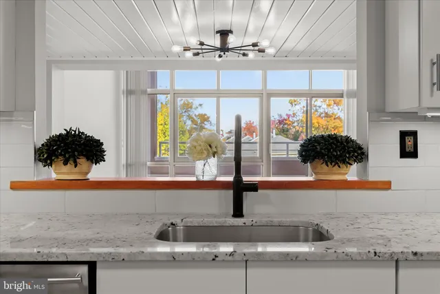 a kitchen with a sink and a window