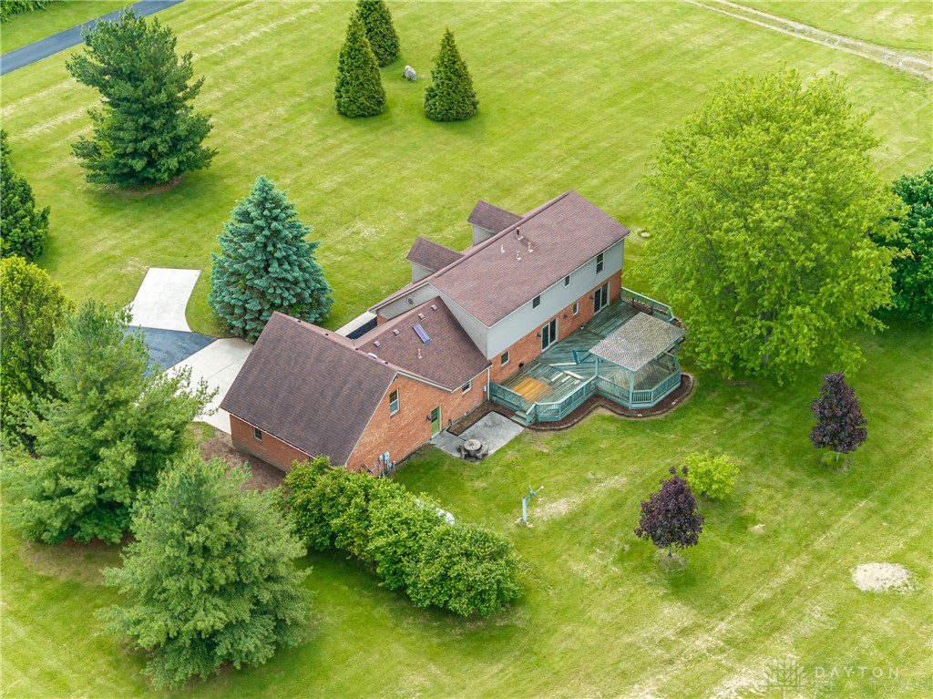 9981 Ridge Acres Lane Englewood, OH 45322 - Photo 57 of 73 This spacious property offers expansive green lawns, mature trees, and a multi-level deck for outdoor enjoyment.
