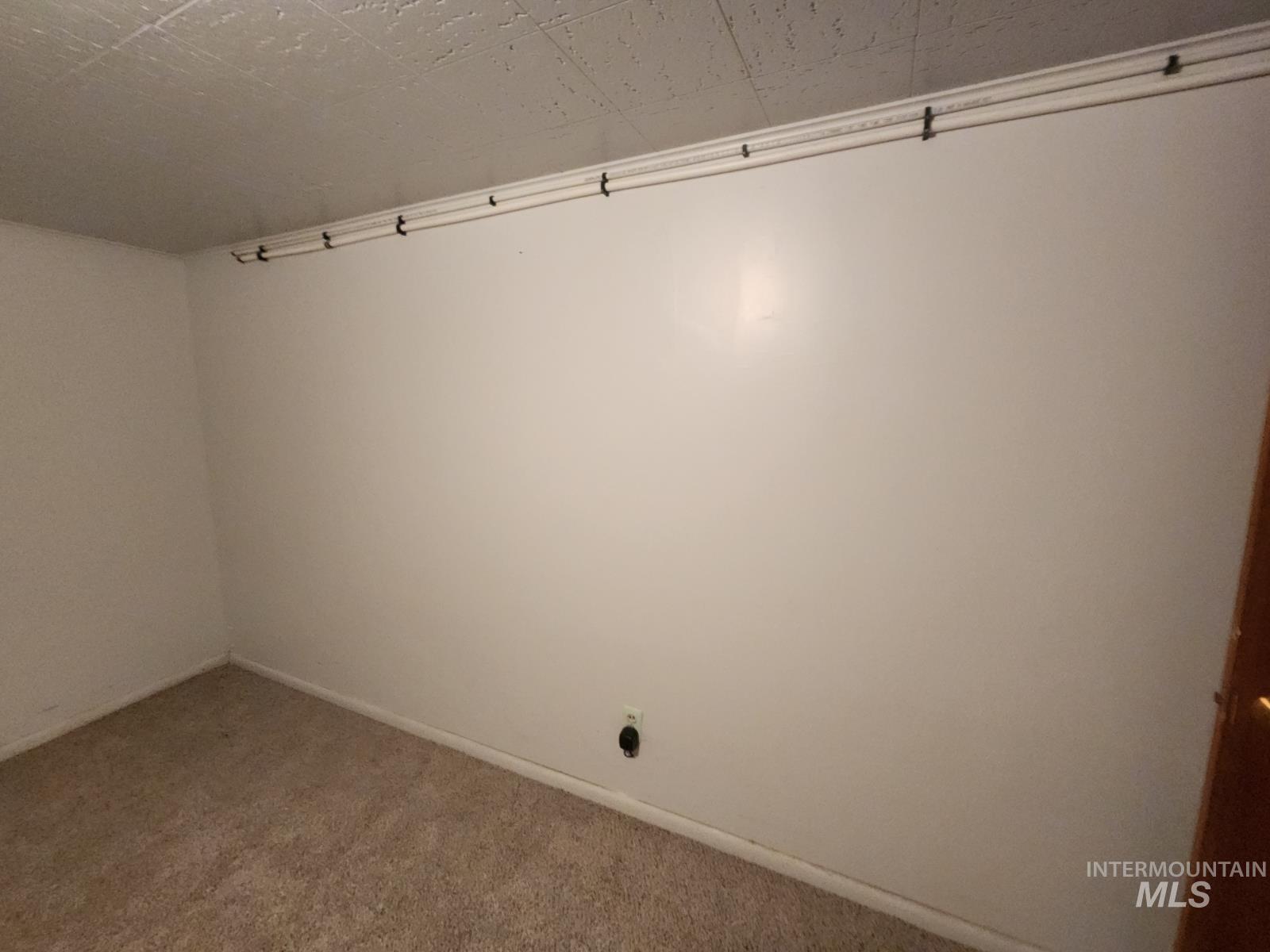 219 South 7th Street Nyssa, OR 97913 - Photo 17 of 29 Unfurnished room with carpet flooring and baseboards