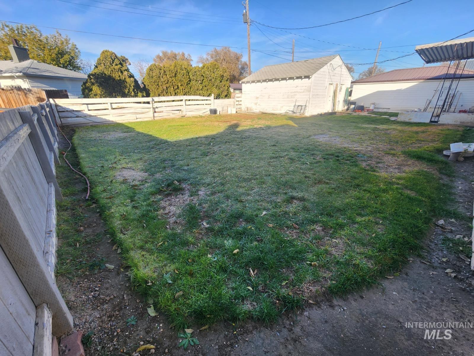 219 South 7th Street Nyssa, OR 97913 - Photo 27 of 29 Fenced backyard with an outbuilding