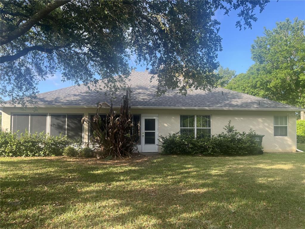 26601 Bull Run Leesburg, FL 34748 - Photo 15 of 15 a front view of a house with garden