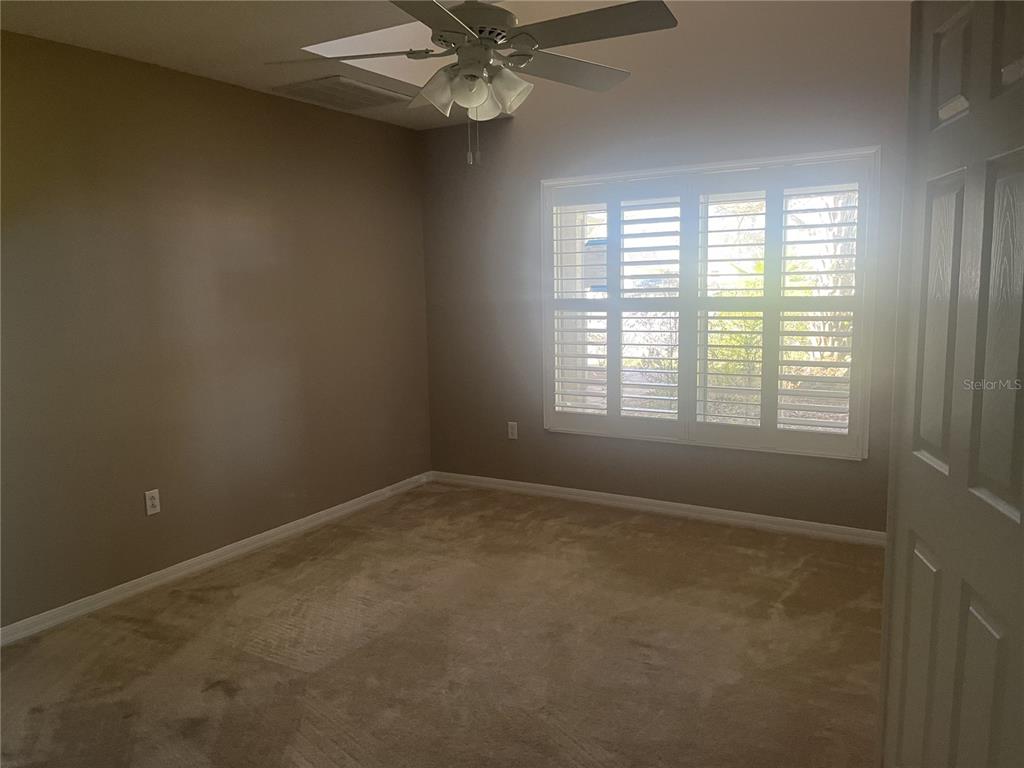 26601 Bull Run Leesburg, FL 34748 - Photo 2 of 15 a view of an empty room with a window